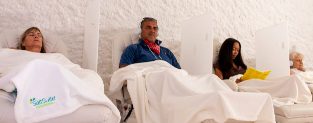 Four clients relaxing as they breath easy during a salt session.