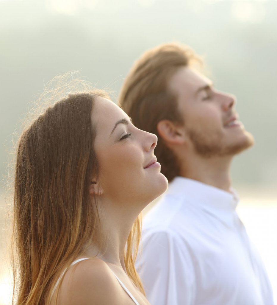 Young man and women breathing easy.