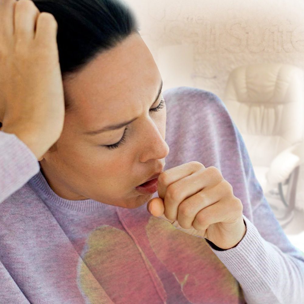 Woman coughing with the Salt Suite as the background.