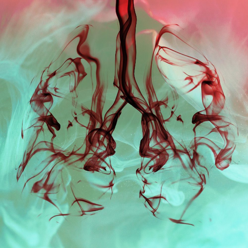 Vibrant color image with blood like design forming the shape of lungs.