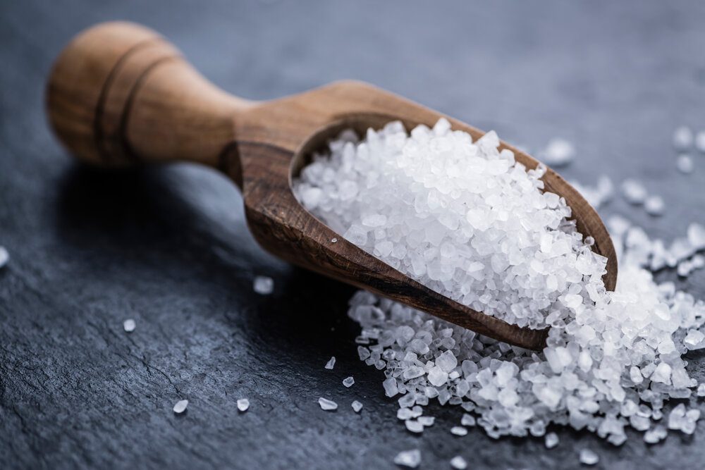Wooden spoon with salt.